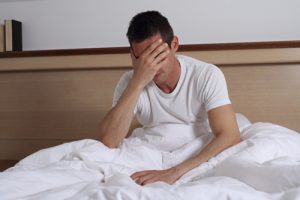 Delirium Tremens and Alcohol Withdrawal - man sick in bed