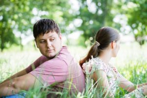 When Saying "No" Is an Act of Love - man and woman back to back