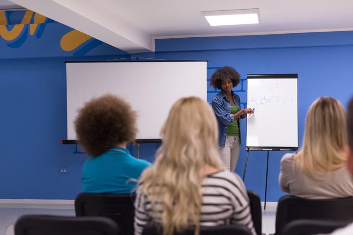 How-Long-Is-the-Typical-Outpatient-Treatment-Program - small group in blue room listening to speaker