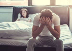 sexual dysfunction, Sexual Health after Rehab, How Substance Use Causes Sexual Dysfunction, Addressing-Sexual-Dysfunction-as-Part-of-Your-Addiction-Recovery - couple in bedroom man upset