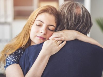 woman embracing her father