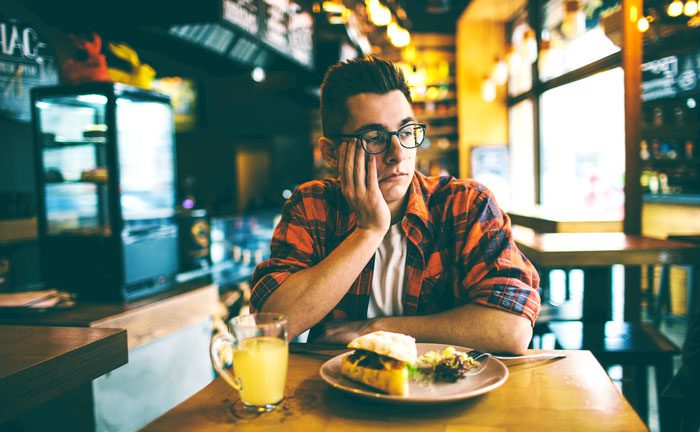 man in restaurant with no appetite