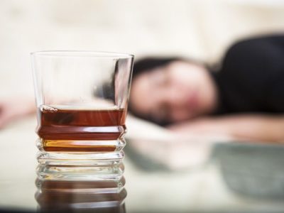 facts about alcohol use disorder alcohol, Facts About Alcoholism You Might Not Know, Facts, Alcohol Abuse Facts, glass of liquor with girl laying down in background