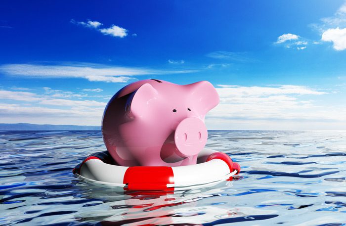 piggy bank on lifesaver in water - addiction treatment