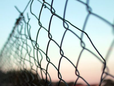 Fears in Recovery, Fears That Can Sabotage Recovery, closeup of chain link fence with sunset in background - fears