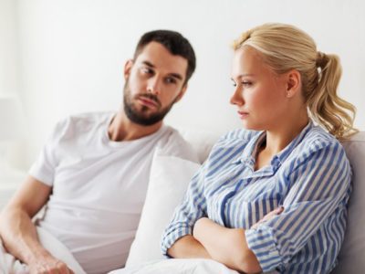 young couple looking upset - spouse's addiction