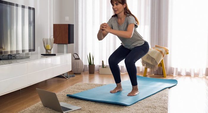 middle age woman doing exercises at home - uncertainty