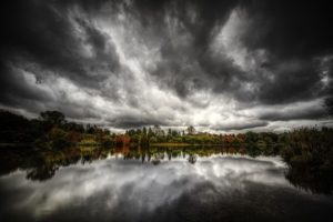 dark and stormy sky reflected over lake - seasonal affective disorder