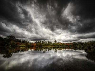 dark and stormy sky reflected over lake - seasonal affective disorder
