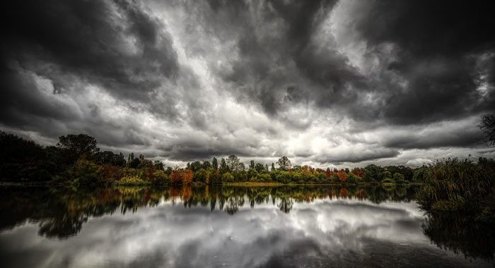dark and stormy sky reflected over lake - seasonal affective disorder