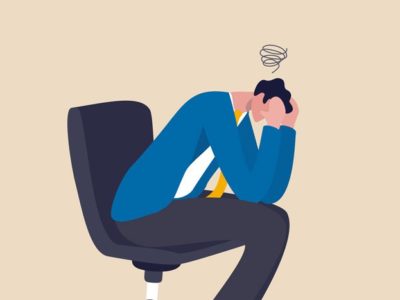 digital illustration of man in work chair, leaned over with hands on his face - frustration