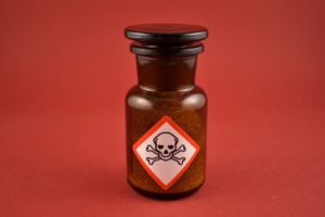 Dangers of Fake Weed, Synthetic cannabinoids, amber glass vial with poison label on it - synthetic marijuana