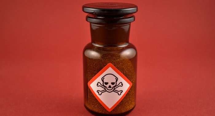 amber glass vial with poison label on it - synthetic marijuana