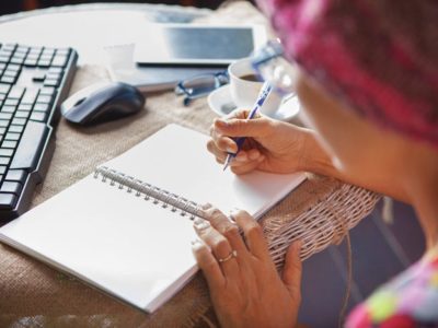 woman writing in her recovery journal