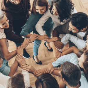 A group of people with their arms locked.