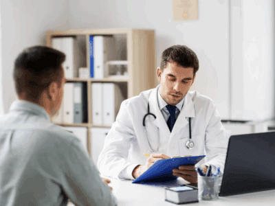 A male patient talking to a doctor.